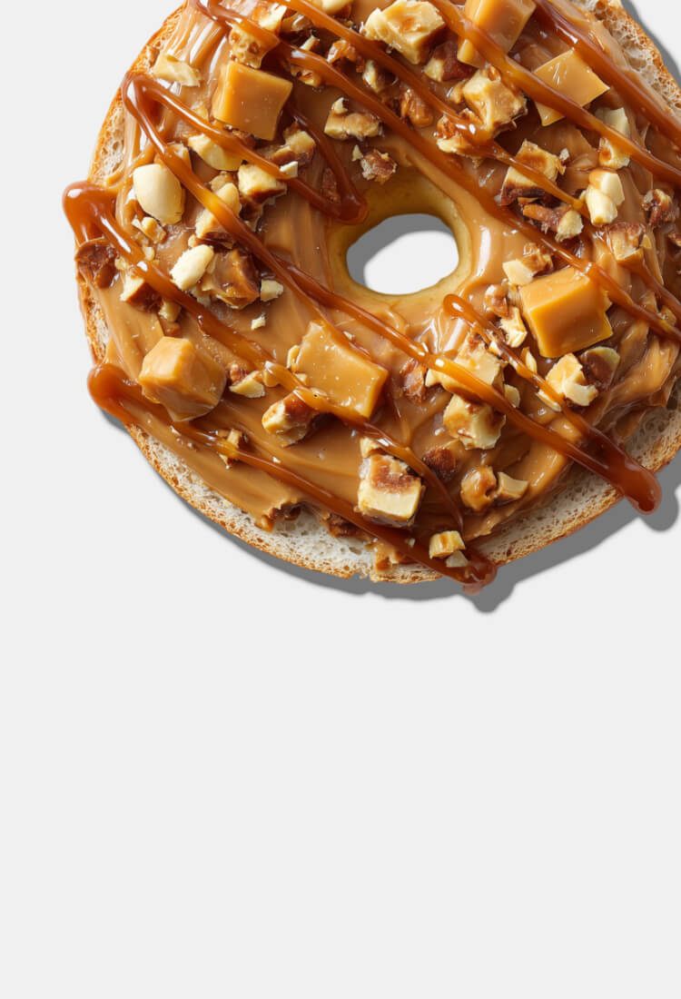 Mobile banner showing a toasted bagel with caramel crunch peanut butter on it